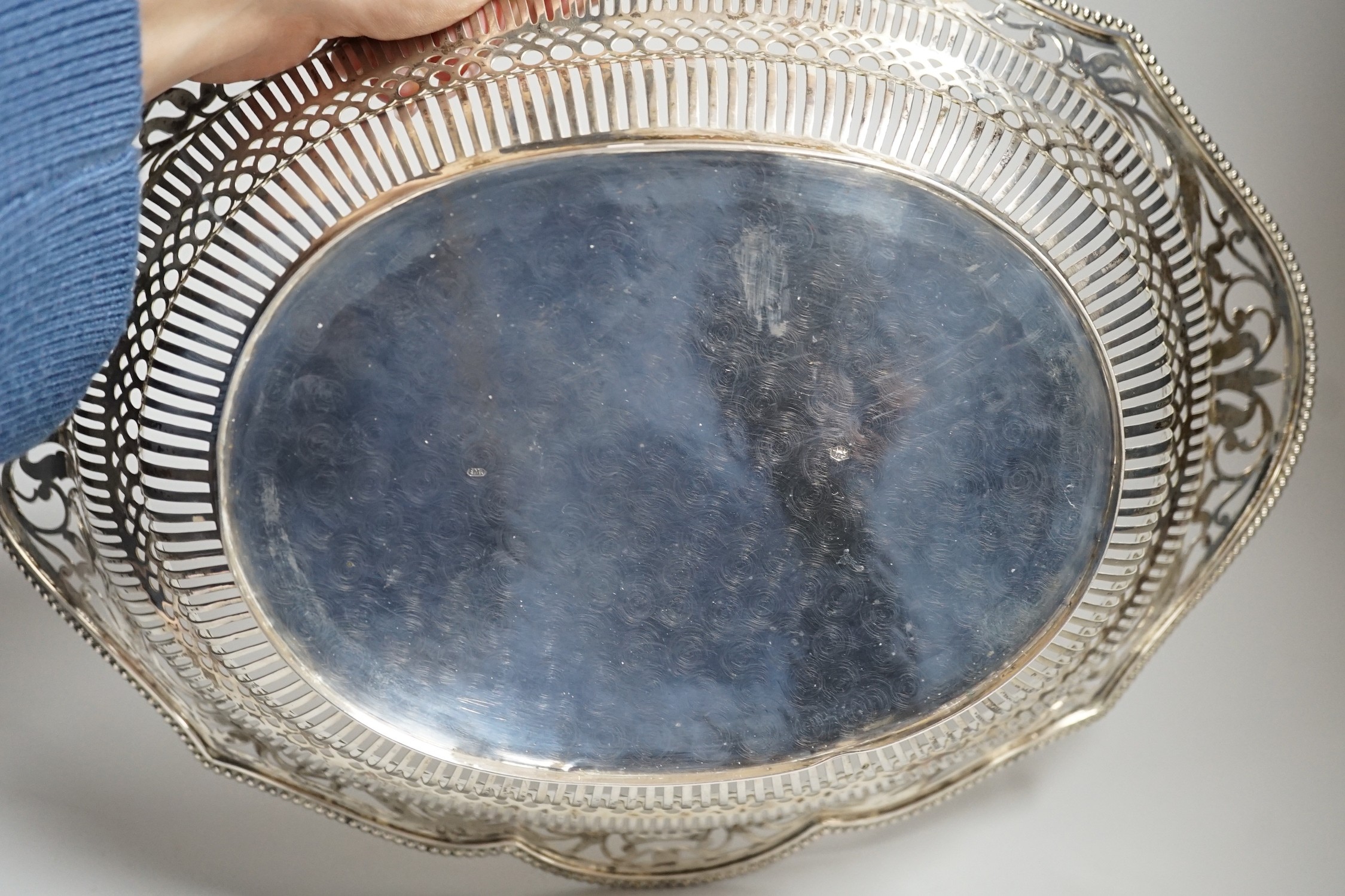 An early 20th century Dutch pierced white metal cake basket, 33.7cm, 16.5oz.